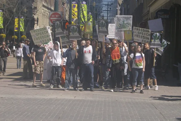 Marchers with banners on a city street