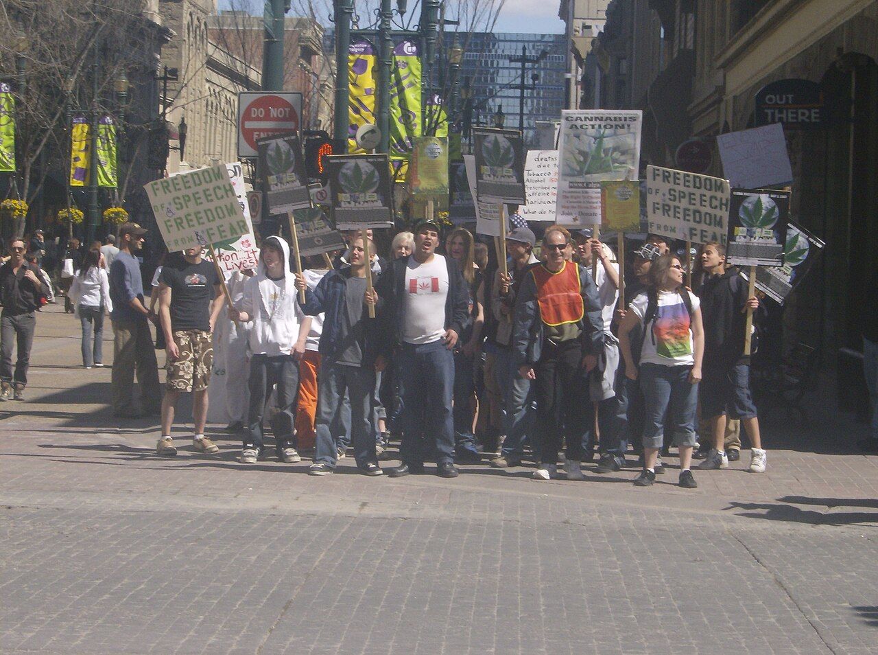 Marchers with banners on a city street