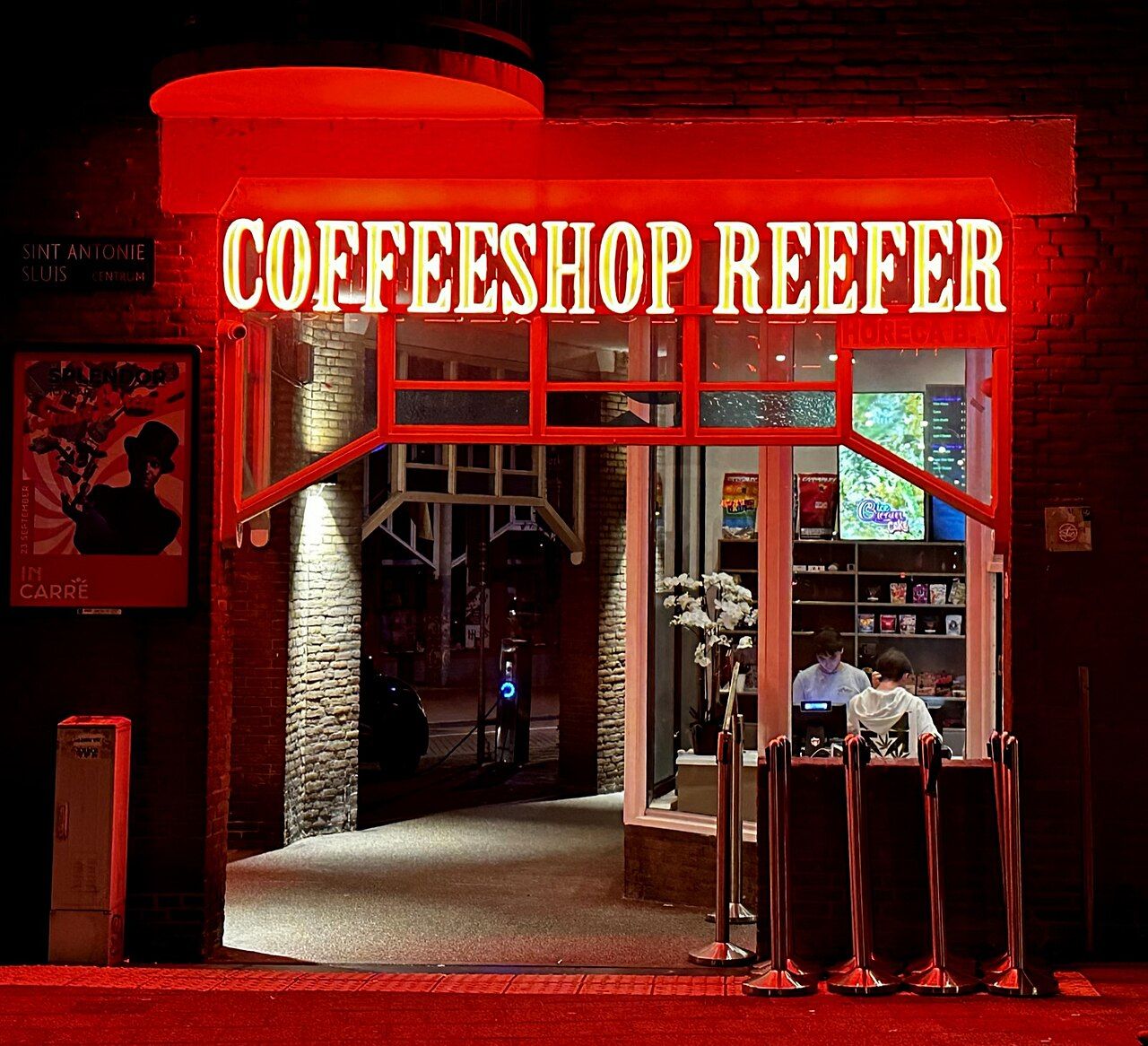 The front of a coffeeshop on a street in Amsterdam