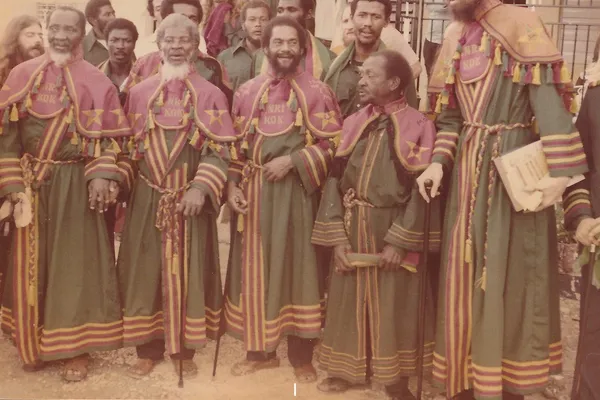 Historical color photograph of Ethiopian Zion Coptic Church members wearing elaborate green, burgundy, and gold religious robes in Jamaica in 1978.