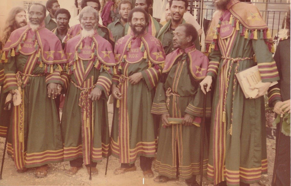 Historical color photograph of Ethiopian Zion Coptic Church members wearing elaborate green, burgundy, and gold religious robes in Jamaica in 1978.