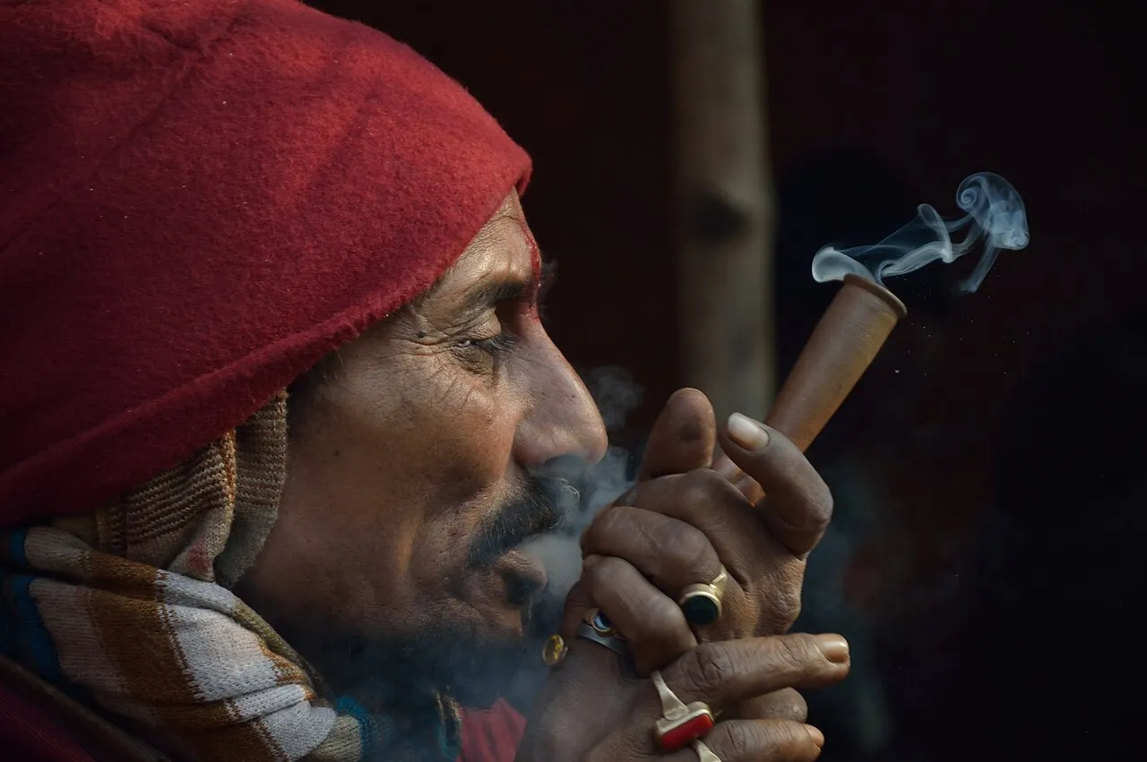A man smoking ganja from a clay chillum