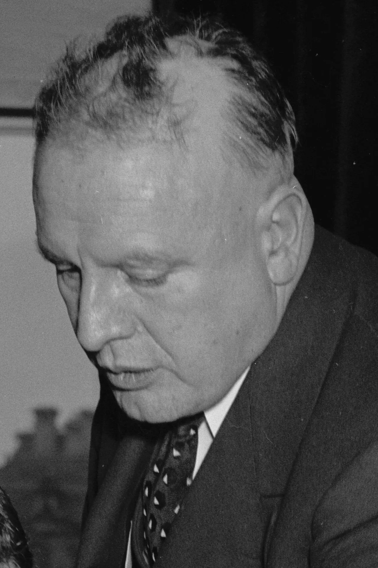 Harry Anslinger looking down at papers