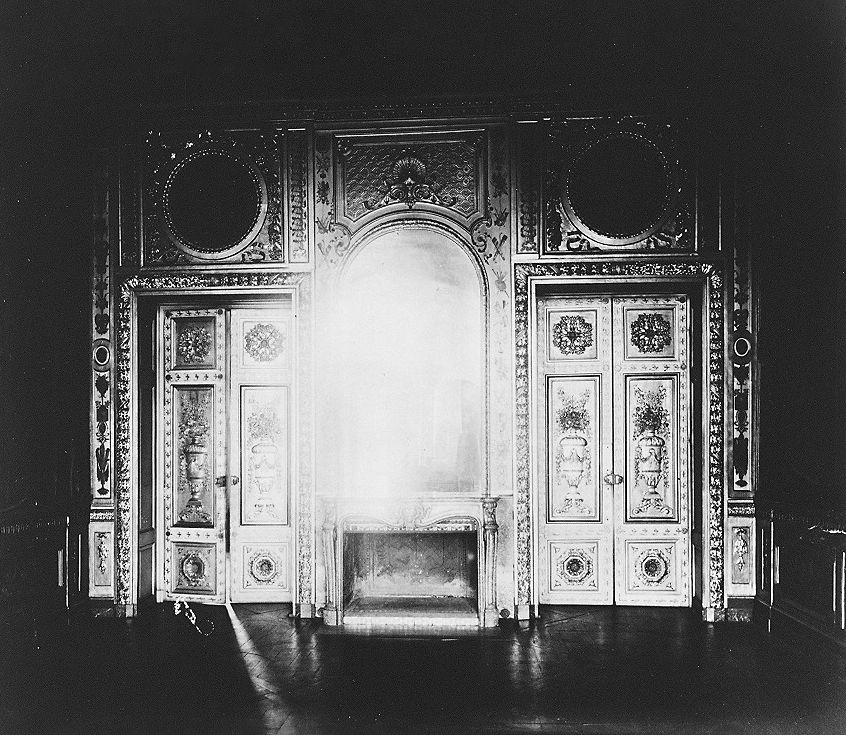 Eugène Atget's black-and-white photograph of an ornate interior with a fireplace at Hôtel de Lauzun in Paris