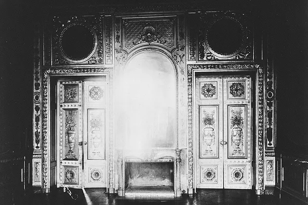 Eugène Atget's black-and-white photograph of an ornate interior with a fireplace at Hôtel de Lauzun in Paris
