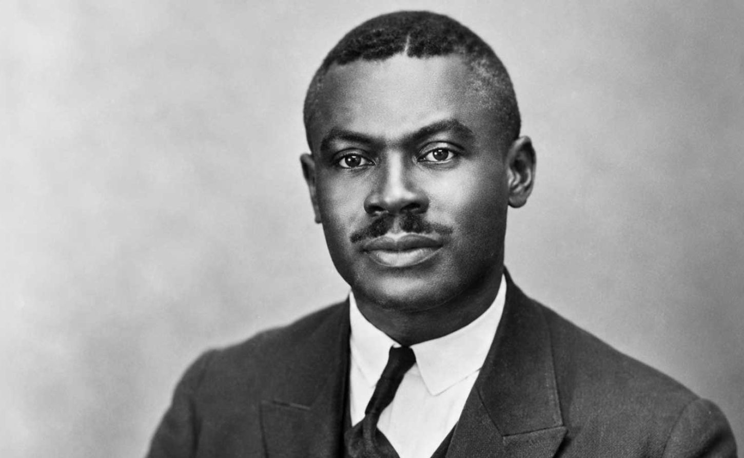 Historical black-and-white portrait of Jamaican Rastafari pioneer Leonard Percival Howell wearing a formal suit and tie.