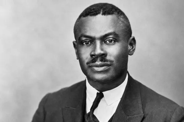 Historical black-and-white portrait of Jamaican Rastafari pioneer Leonard Percival Howell wearing a formal suit and tie.