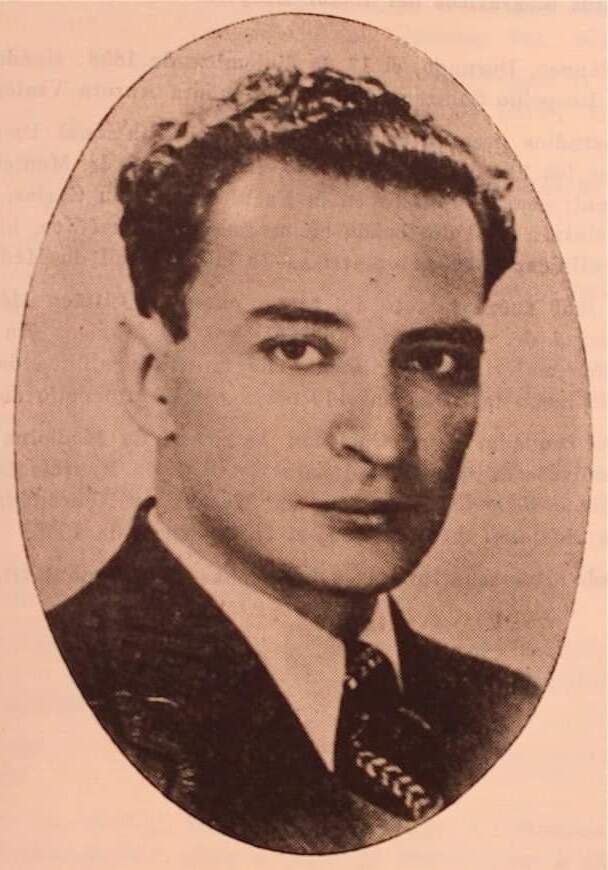 Oval sepia portrait of a young man with dark wavy hair in a suit and tie