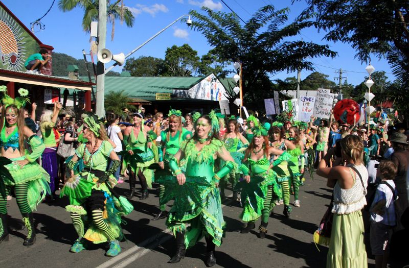 Dancers in green costumes in a street parade