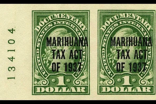 Two green one-dollar US revenue stamps labelled Marihuana Tax Act of 1937