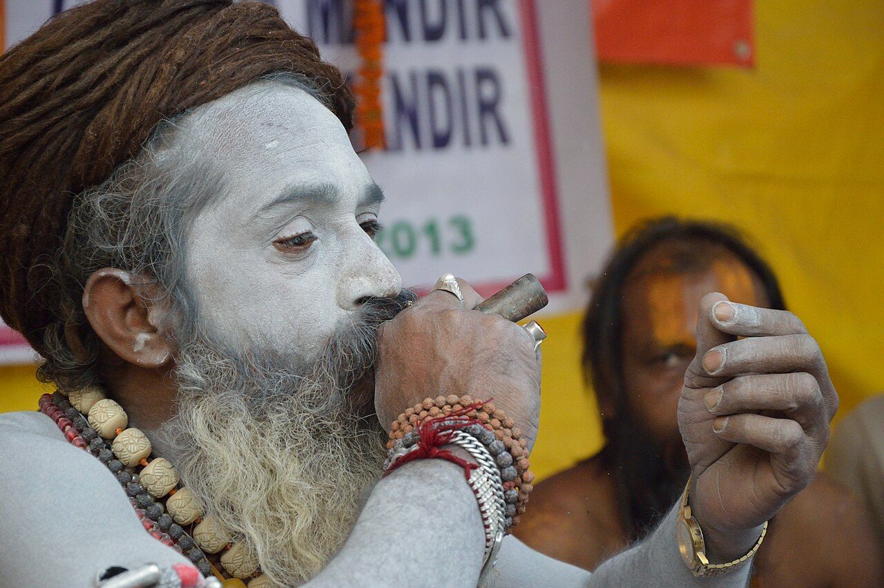 A sadhu smoking a chillum