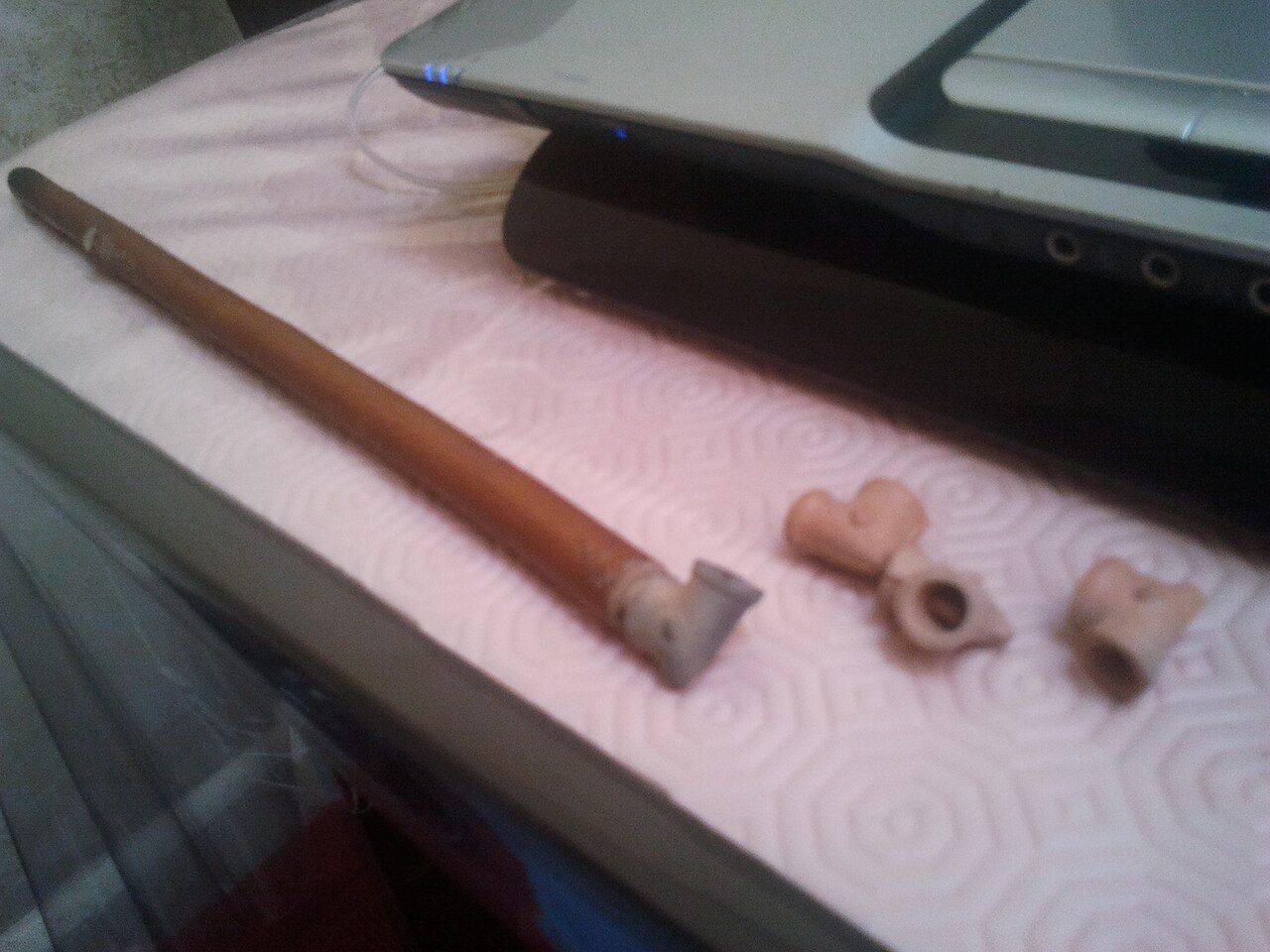 A sebsi, a long thin wooden pipe with a small clay bowl