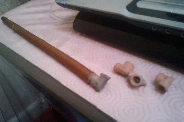 A sebsi, a long thin wooden pipe with a small clay bowl