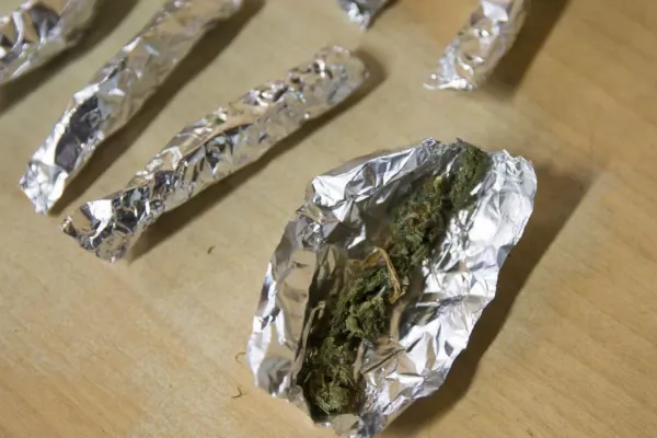Small portions of cannabis individually wrapped in aluminium foil, photographed during a New Zealand tinny-house investigation.