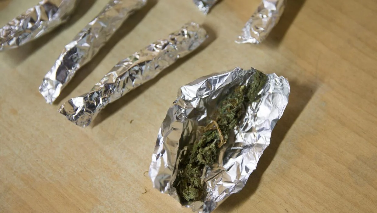 Small portions of cannabis individually wrapped in aluminium foil, photographed during a New Zealand tinny-house investigation.