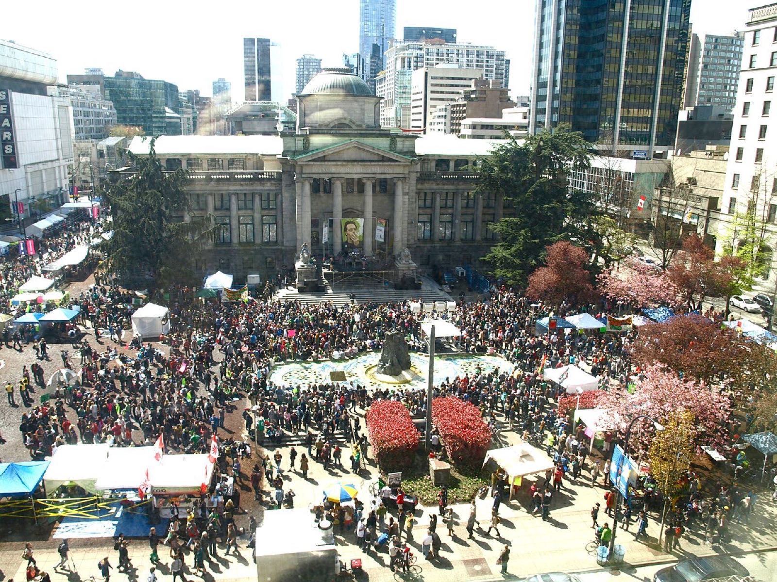 A large crowd gathered in a city square